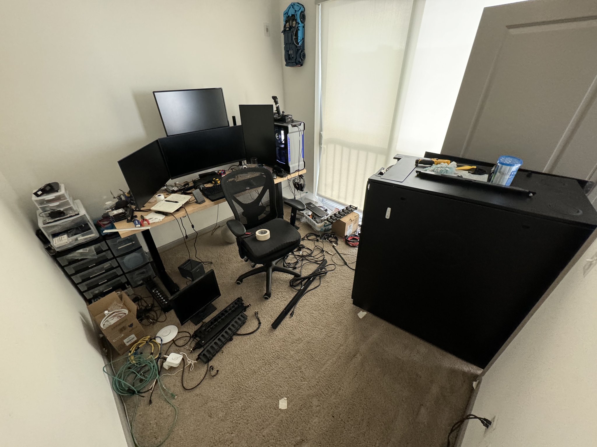 The office with the rack pulled away from the wall.