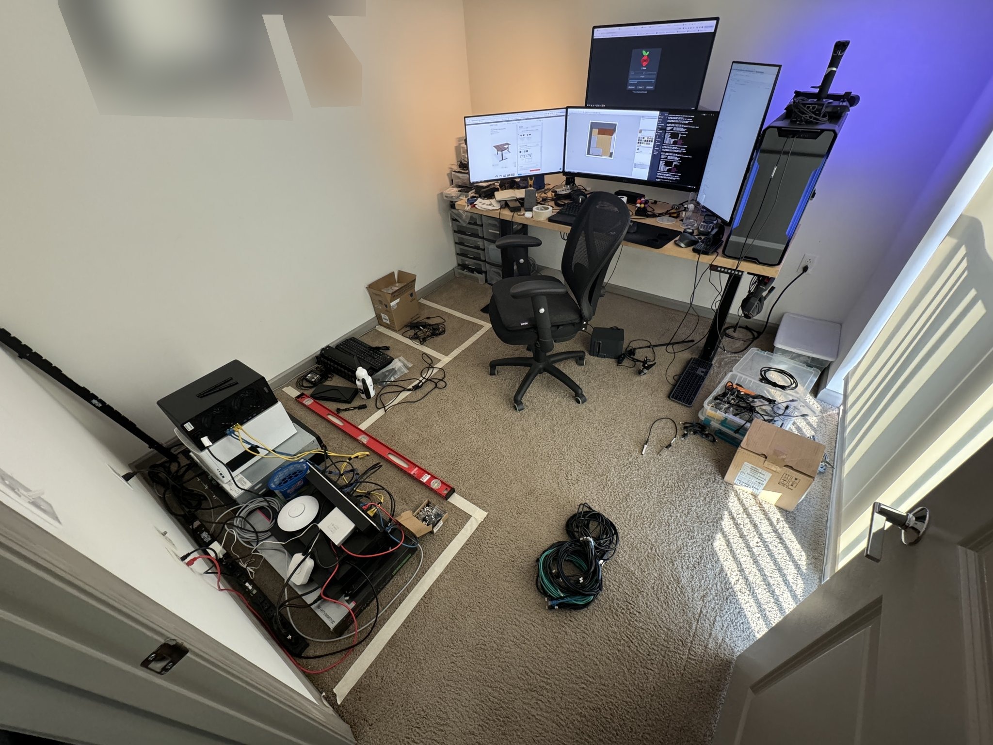 The office with the network gear spread out on the floor.