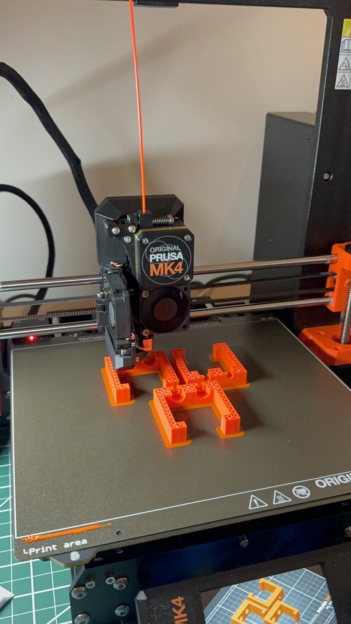 A closer look at the mounting brackets being printed.