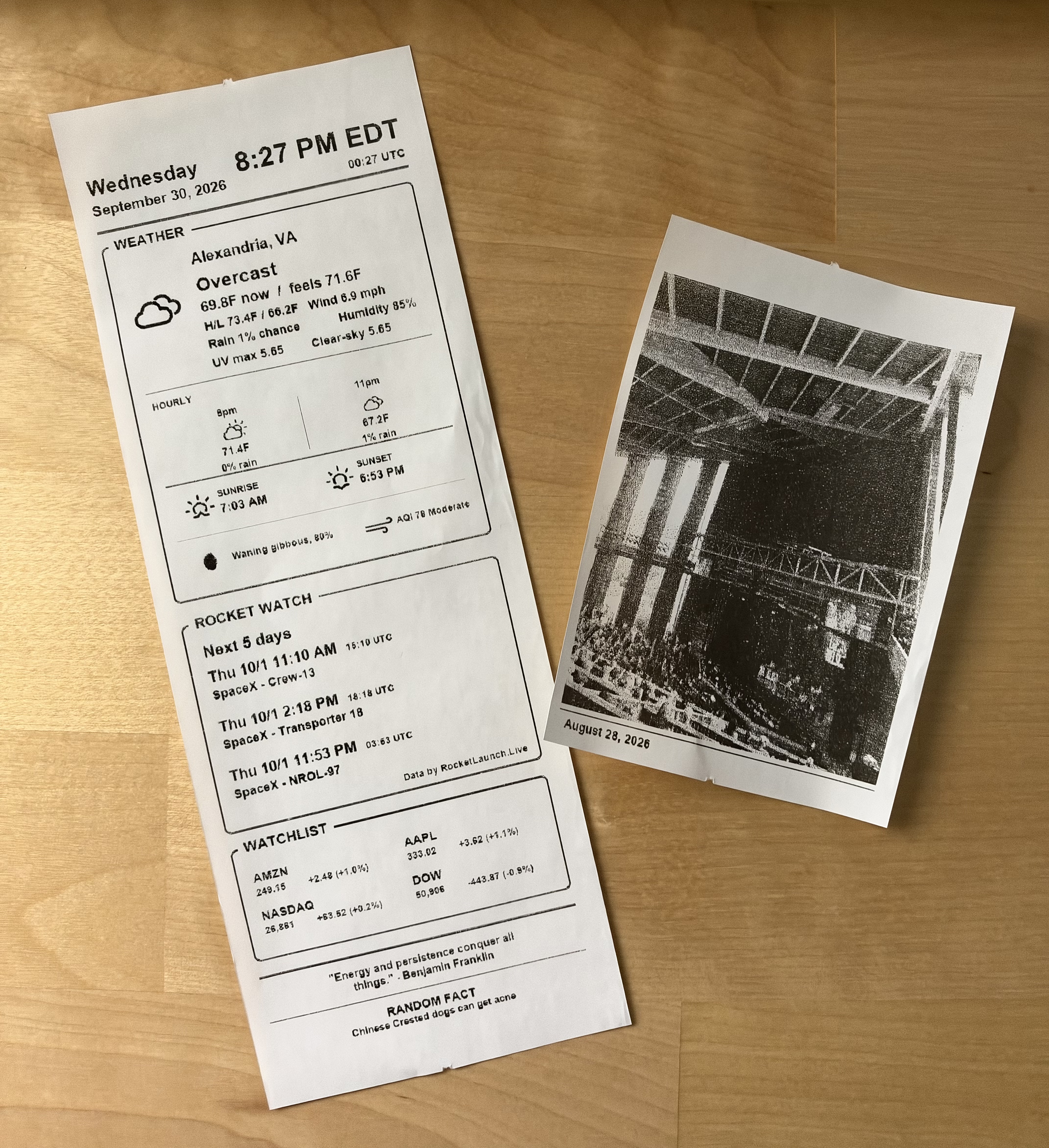 A printed daily summary receipt alongside a printed photo receipt
